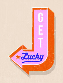 Wall art featuring a retro neon sign that evokes feelings of luck and a nostalgic mood.