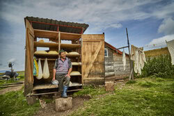 Landscape photo of a cheesemaker in the Eastern Carpathians