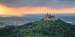 Wall art by Achim Thomae: Hohenzollern Castle bathed in warm light during golden hour