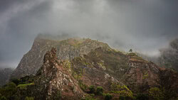 Photo art by J. Daniel Hunger: soft fog surrounds tall mountains