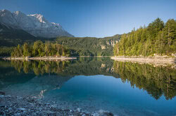 Photo art by Thomas Junklewitz: calm reflection at Eibsee in the mountains