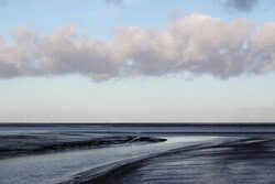 Photo art by Manuela Deigert: calm scene of a creek in the Wadden Sea at low tide