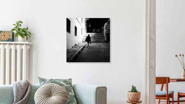 A woman walking in the dark, Greece – wall art by Nasos Zovoilis as Poster or Acrylic Glass Print