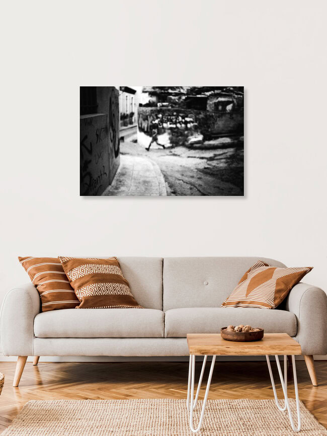 A young boy running, Griechenland – Fotokunst von Nasos Zovoilis als Poster oder Acrylglasbild