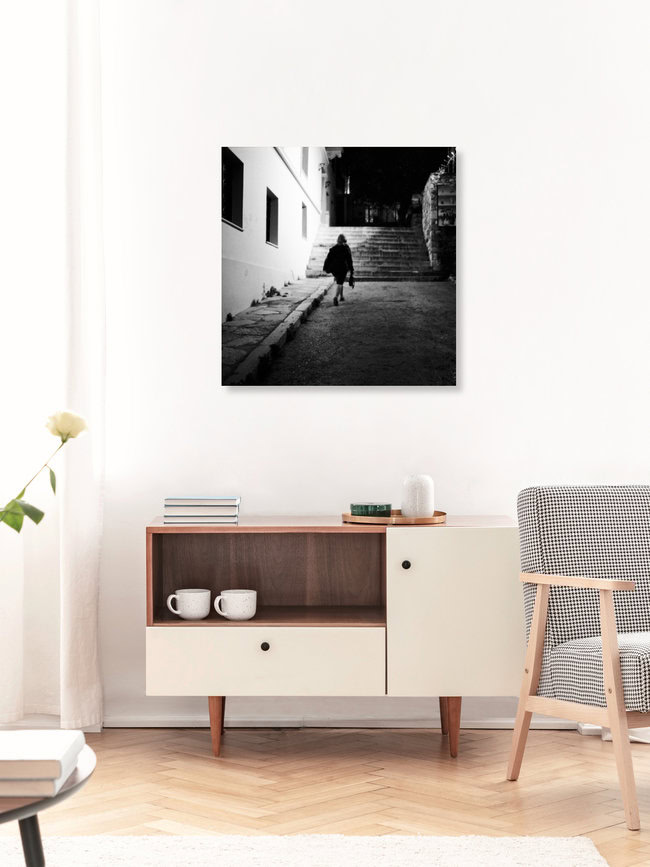 A woman walking in the dark, Greece – wall art by Nasos Zovoilis as Poster or Acrylic Glass Print