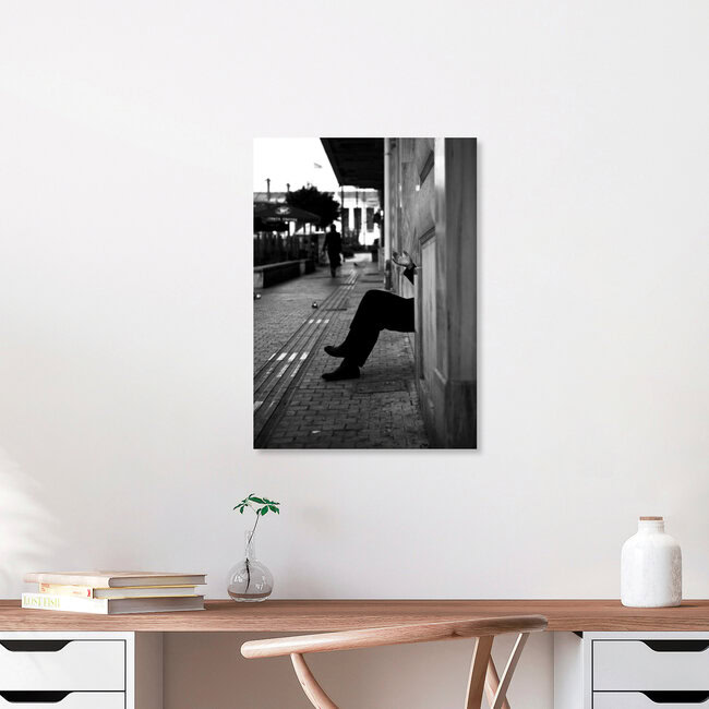 A man smoking outside of a building, Greece – wall art by Nasos Zovoilis as Poster or Acrylic Glass Print