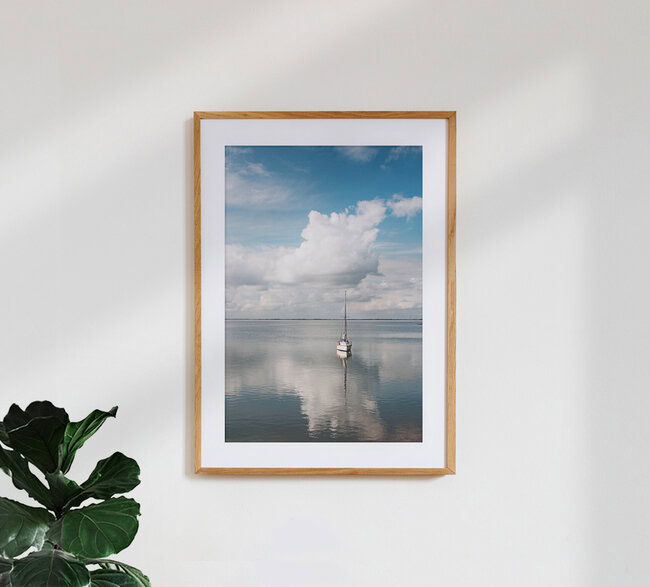 The boat in the clouds, Germany – wall art by Manuela Deigert as Poster or Acrylic Glass Print