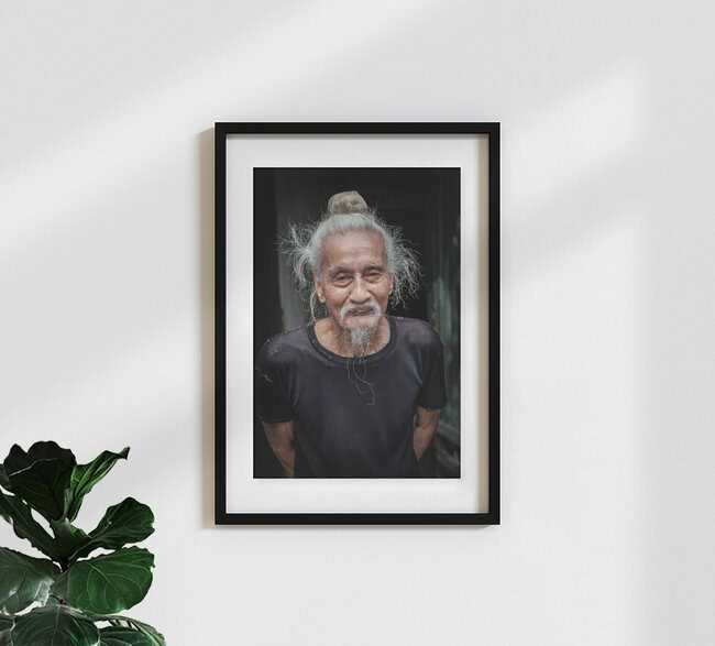 Old man in the streets of Ha Noi, Vietnam – wall art by Jörg Faißt as Poster or Acrylic Glass Print
