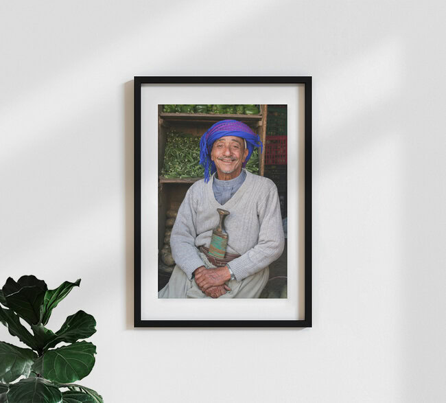 Smiling market trader in the bazaar of Sana'a, Jemen, Yemen – wall art by Christine Wawra as Poster or Acrylic Glass Print