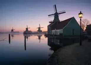 Photo art by Patrick Noack: Morning fog over traditional windmills in the Netherlands