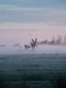 Photo art of a calm landscape in the fog of the Netherlands