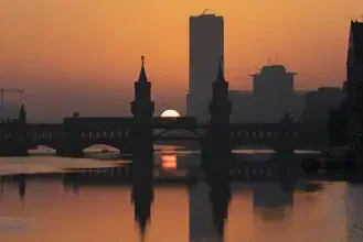 Photo art by Patrick Noack: golden evening light over Berlin's Oberbaum Bridge