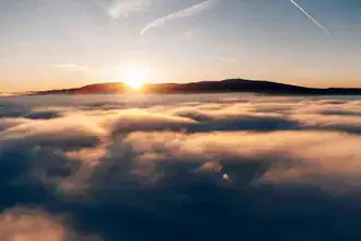 Sunset above the clouds in the Harz Mountains, calm and peaceful atmosphere.