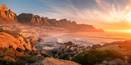 Colorful sunset over the sea in Camps Bay, South Africa.