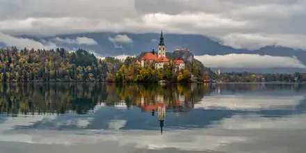 Lovely morning atmosphere at Lake Bled with church and castle in the background