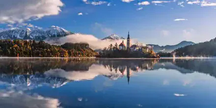 Photo art by Achim Thomae: sunrise over Lake Bled in soft colors.