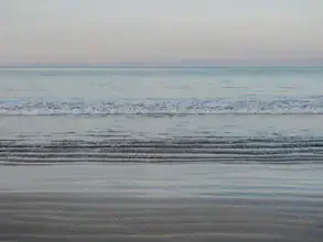 Photo art by Diana & Ronnie: The Mediterranean Sea with gentle waves and a clear sky.