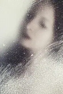 Photo art by Manuela Deigert: woman with glass in a winter dreamland