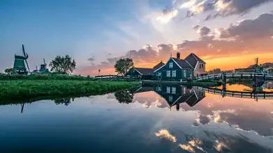 Photo art by Achim Thomae: sunrise over a peaceful Dutch village