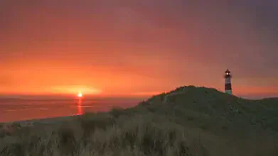 Photo art by Achim Thomae: sunrise over the Sylt coastline with soft colors.