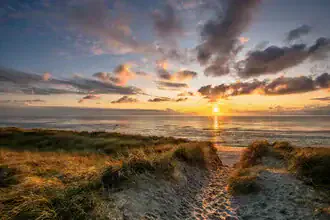 Photo art by Achim Thomae: sunset over the coastline of Sylt