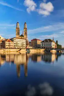 Photo art by Achim Thomae: Grossmünster in Zurich under soft clouds in the sky