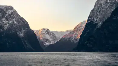 Photo art by Norbert Gräf: wintery Nærøyfjord with gentle mountains in evening light