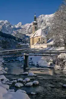 Photo art by Achim Thomae: winter landscape in the Bavarian Alps with a snow-covered church