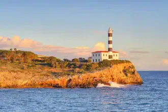 Photo art by Michael Valjak: lighthouse in Portocolom, Mallorca by the calm sea