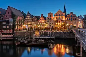 Photo art by Achim Thomae: calm blue hour over Lüneburg's old town