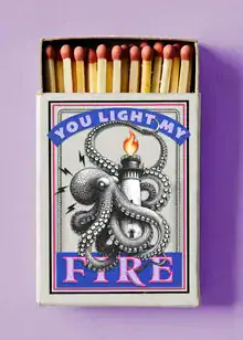 Wall art featuring a funny scene: a lighthouse and matches igniting a fire.
