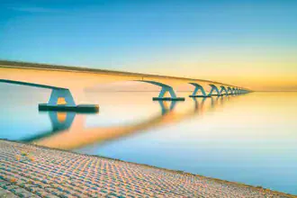 Photo art by Michael Valjak: Zeeland Bridge in warm morning light