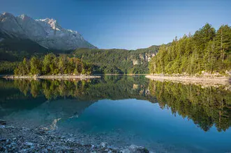 Photo art by Thomas Junklewitz: calm reflection at Eibsee in the mountains