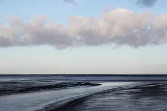 Photo art by Manuela Deigert: calm scene of a creek in the Wadden Sea at low tide