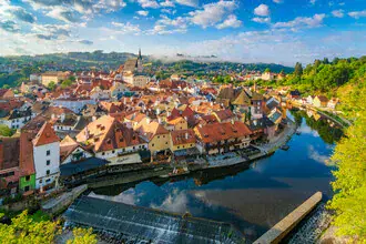 Photo art: Summer morning over the old town of Český Krumlov by the Vltava River.