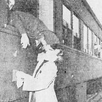 Pvt. Thomas Hicks gets a goodbye kiss from Miss Max Cotter at the train station in Salinas. C_Co__194_BTW-5