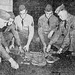 Sgt. W. Braye, Sgt. G. D. Krokaw, Cpl. J. H. Hart, Sgt. C. A. Felice, and S/Sgt. J. E. Oral practice rolling up a pack.
Only William Braye and James Hart went to the Philippines. C_Co__194_BTW_1