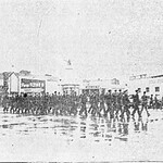 C Company, 194th Tank Battalion marching from the armory in Salinas to train station. The Salinas Jr. College band leads the soldiers. C_Co__194_BTW_3