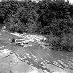 C Company washes staff cars of the 192nd in the Salt River Cars in Salt RIver