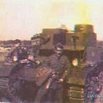 Pvt. Manuel Nevarez in front of a C Company tank.