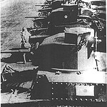 A Japanese soldier leans on one of four captured American tanks somewhere on Luzon. Even though an order to destroy all their equipment was given to American tank crews, not all the tanks on Bataan were destroyed. - Courtesy of Albert Allen Captured American tanks