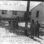 Members of A Company dig a trench outside of their barracks. Sandmire48