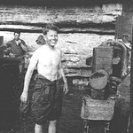 Harvey Riedeman stands behind his tank during a tank washing at Ft. Knox. Sandmire22