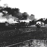 Buildings burn outside of San Fernando in Central Luzon as Filipino and American troops fall back toward Bataan. Allen2