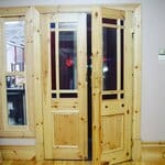 This image showcases elegant Baltic pine sidelights, known for their warm, natural wood grain and durability, perfect for enhancing entryways with a touch of classic elegance and natural beauty. Baltic Pine Sidelites