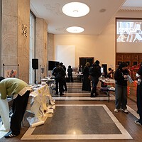 Art community gathering promoting creativity and collaboration in a vibrant, light-filled space.