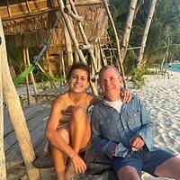 Relaxing couple enjoying the beach in the Philippines.