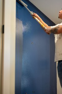 High-quality interior wall painting service by John Langevin, expert in commercial and residential painting solutions.