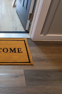 Welcoming entryway doormat with "WELCOME" message for home or office, perfect for guest arrivals.