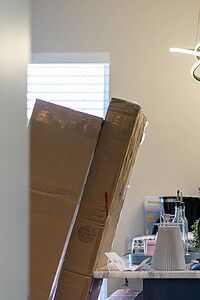 Moving boxes and household items arranged for relocation or organization.